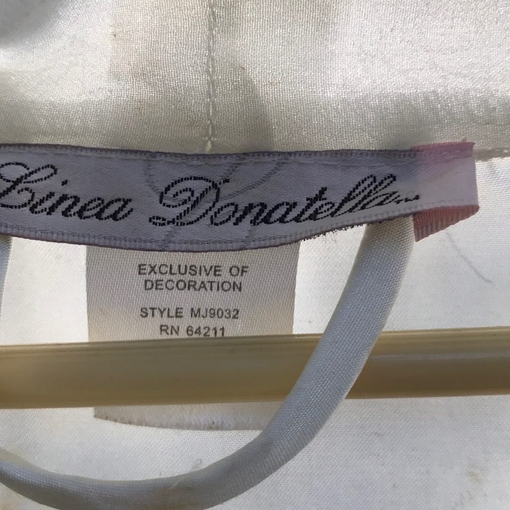 It’s like a fairytale bride nightgown and robe. White with pearls decorative .